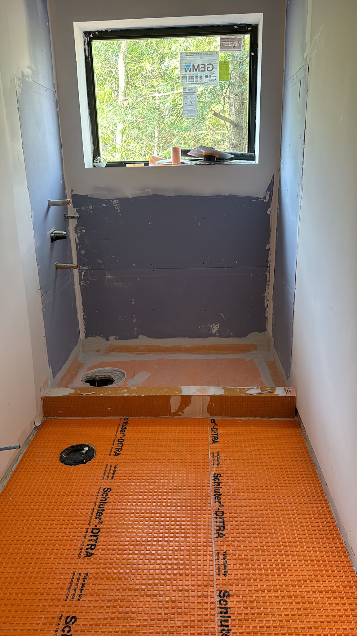 Washroom shower waterproofing and shower pan preparation before tile installation