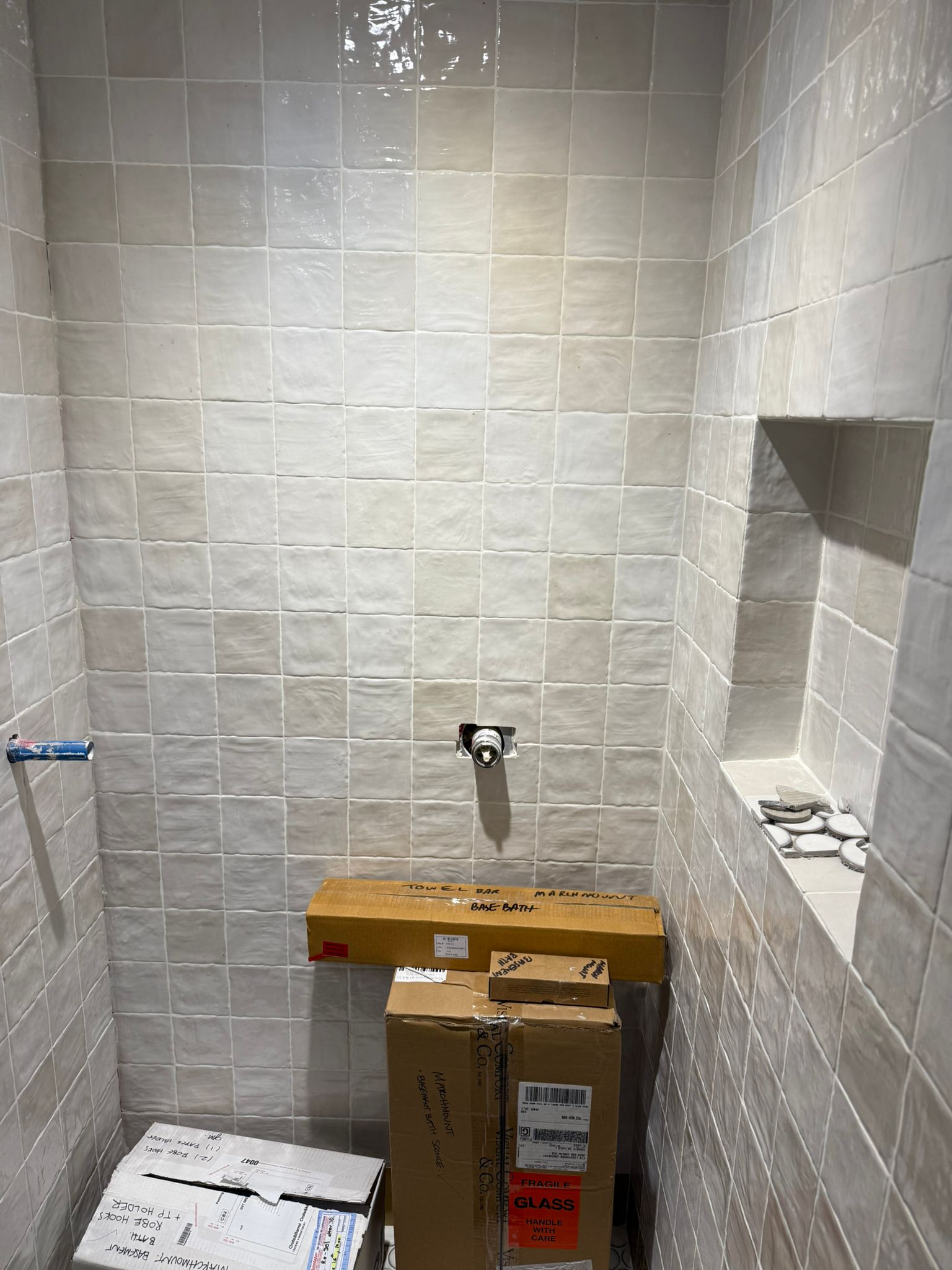 Handmade-look shower wall tile with niche detail